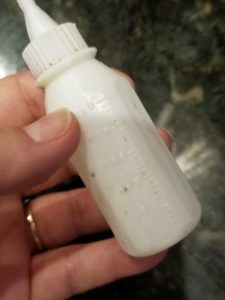 close up of baby bottle toy