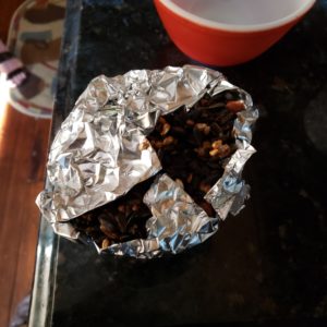 2022 first attempt at bird seed and peanut butter "cake" in foil on the kitchen counter
