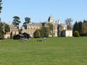 birds on the lawn behind a castle or mansion; Guinea fowl at Narford Hall by Evelyn Simak