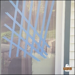 blue tape on glass door