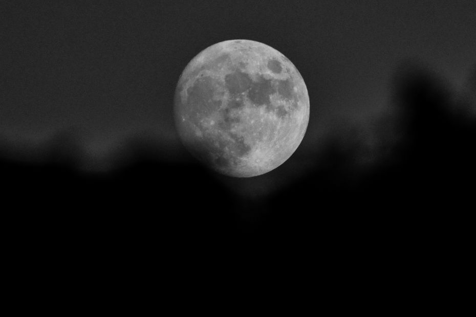 Canva stock image of a full moon in black and white