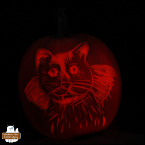 artist Meg Cocho's finished carving of Gus as a vampire into a pumpkin, 2023